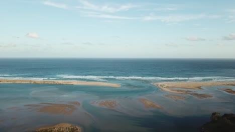 Drone-footage-of-the-mouth-of-the-Wallagaraugh-River-at-Mallacoota,-eastern-Victoria,-Australia,-December-2020