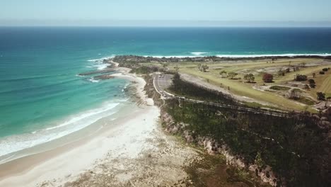 Drone-footage-of-burnt-vegetation-and-the-golf-course-at-Bastion-Point,-at-Mallacoota-in-eastern-Victoria,-Australia,-December-2020