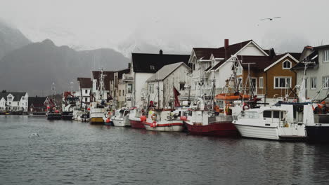 Fishing-Boats-Docked-Next-To-Houses-In-A-Fishing-Village