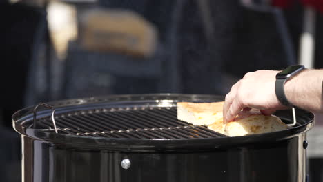 Chef-Toasting-Bread-In-A-Charcoal-Griller