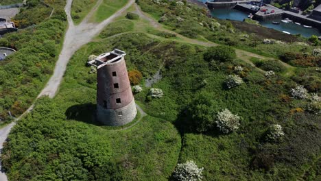 Amlwch-port-red-brick-disused-abandoned-windmill-coastal-aerial-view-North-Anglesey-Wales