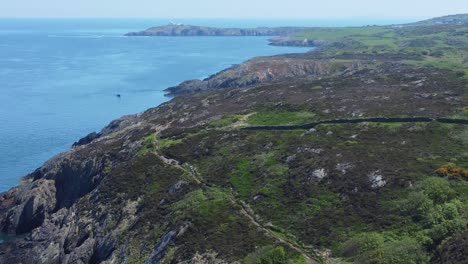 Peaceful-Amlwch-Anglesey-North-Wales-rugged-mountain-coastal-walk-aerial-view-coast-reveal