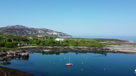 Soldiers-point-house-Aerial-view-over-historic-Holyhead-marina-boats-Welsh-mountain-abandoned-coastal-remains-grounds