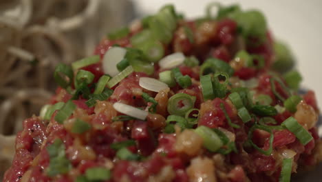 Macro-Of-Steak-Tartare-Dish-Sprinkled-With-Green-Onions