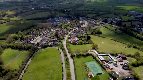 High-altitude-drone-video-footage-of-a-small-village-in-England