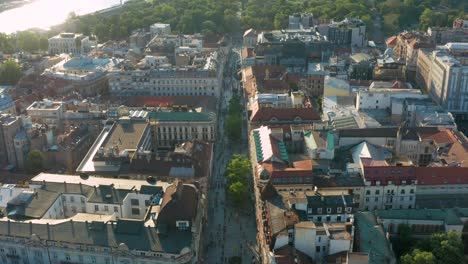 Drone-Flight-Above-Prominent-Street-With-Historic-Building