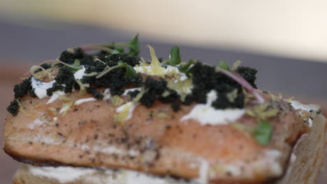 Grilled-Salmon-Topped-With-Black-Caviar,-Herbs,-And-Mayo