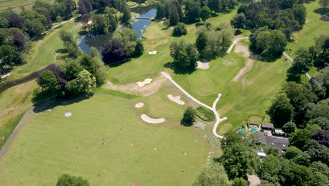 Aerial-of-beautiful-green-golf-course-in-summer