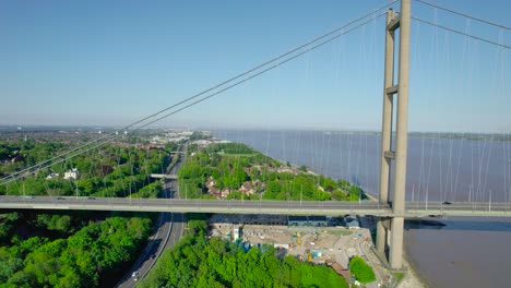 Smooth-tilt-up-descending-aerial-of-the-south-towers-of-the-Humber-Bridge
