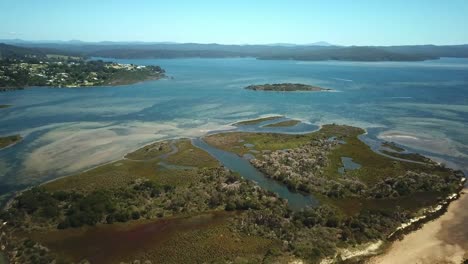 Drone-view-over-Goat-Island-in-the-Mallacoota-Inlet-at-low-tide,-in-eastern-Victoria,-Australia,-December-2020