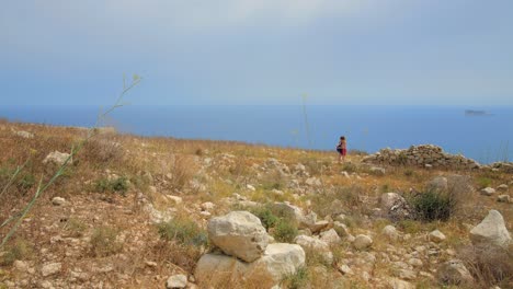 Tourist-walking-near-ruins-on-the-island-of-Malta