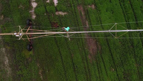 Agronomist-Checking-Irrigating-System-For-Farm-Management---aerial-top-down