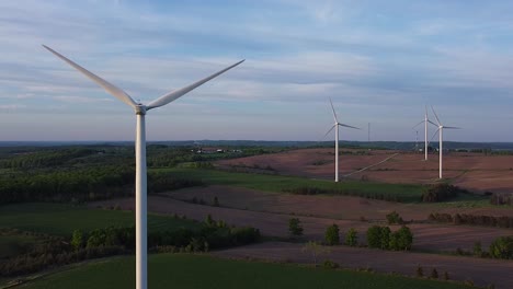 Aerial-of-clean-renewable-sustainable-energy-wind-turbine-farms-on-fields