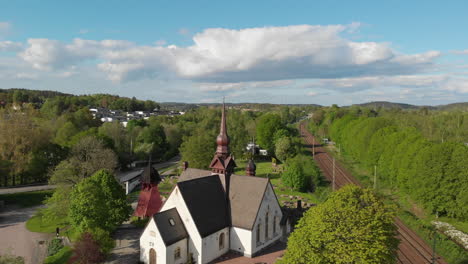 4K-Aerial-Footage-Rising-Over-the-Lerum-Kyrka-Church-in-the-Town-of-Lerum-in-Vastra-Gotaland,-Sweden