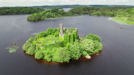 Aerial-view-of-McDermott's-castle-on-Lough-Key,-covered-in-sun
