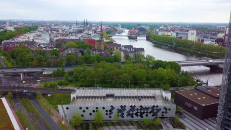 Aerial-View-Of-Parkhaus-Weser-Quartier-Near-Weser-Tower-Along-The-River-In-Bremen,-Germany