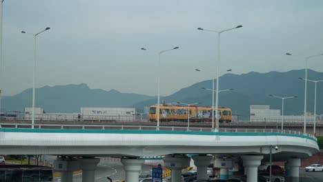 Rail-Transit-Travelling-By-Elevated-Railway-At-Gimhae-International-Airport-In-Gangseo-District,-Busan,-South-Korea