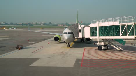 Passenger-Boarding-Bridge-Connected-To-A-Parked-Airplane-From-Domestic-Terminal-Gate-At-Gimpo-International-Airport-In-Seoul