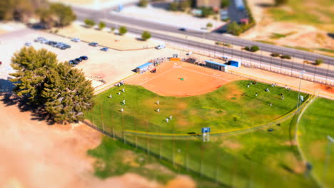 Aerial-view-of-teams-taking-the-field-to-play-a-baseball-game---tilt-shift-or-miniature-effect-added