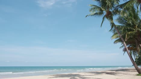 4K-Static-Shot-of-Beautiful-Tropical-Beach-with-Palm-Trees-and-Scenic-Views-on-the-Island-of-Koh-Chang,-Thailand