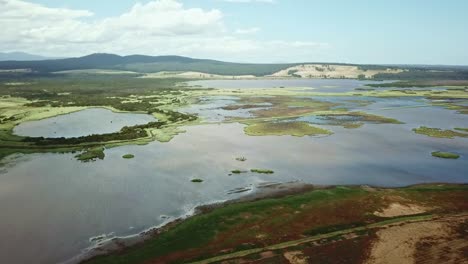 Aerial-footage-of-the-flood-plains-of-the-Lake-Curlip-Wildlife-Reserve,-alongside-the-Snowy-River,-near-Marlo,-in-Gippsland,-Victoria,-Australia,-December-2020