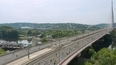 Aerial-View-Of-Marathon-Runners-At-Ada-Bridge
