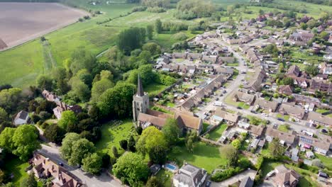 Aerial-video-flying-towards-a-church-in-a-village-in-Kent,-UK