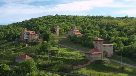 Aerial-View-Of-Srediste-Monastery-With-The-Green-Mountain-In-Banat,-Serbia