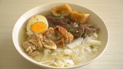 paste-of-rice-flour-or-boiled-Chinese-pasta-square-with-pork-in-clear-soup