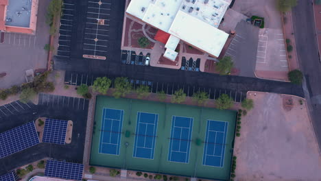 Top-View-Of-Empty-Tennis-Courts-In-A-Recreational-Facility-During-Pandemic
