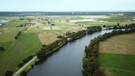 Aerial-footage-along-the-Snowy-River-and-adjacent-wetlands-near-Marlo,-in-Gippsland,-Victoria,-Australia,-December-2020
