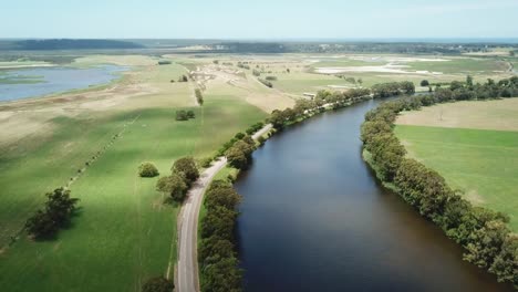 Drone-flying-along-the-Snowy-River-and-adjacent-wetlands-near-Marlo,-in-Gippsland,-Victoria,-Australia,-December-2020