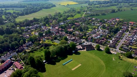 A-aerial-video-showing-a-village-cricket-ground-in-Kent,-UK