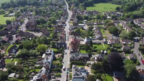 4K-drone-video-of-the-village-of-Bridge-near-Canterbury-with-cars-underneath-in-chase-mode