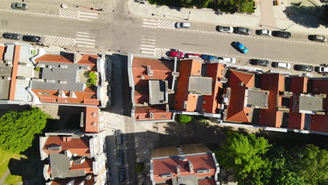 Bird's-Eye-View-Of-Houses-And-Vehicles-Driving-In-The-Road-Of-Old-Town-Gdansk-In-Poland