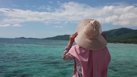 Woman-tourist-in-summer-hat-enjoying-summer-holiday-at-Karimun-Jawa