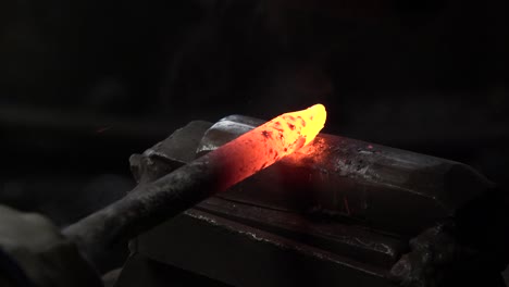 The-blacksmith-strikes-hot-metal-with-a-hammer