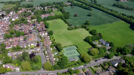 4K-drone-video-of-the-village-of-Bridge-near-Canterbury-with-tennis-courts-underneath