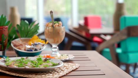 Seafood-shrimp-cocktails-and-aguachile-slider-shot-inside-mexican-restaurant
