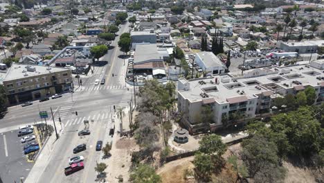 Aerial-drone-view-following-a-ambulance,-driving-in-the-neighborhoods-of-Los-Angeles