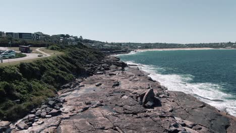 Rocky-Coastline-And-Blue-Waterscape-Of-Freshwater-Beach-In-New-South-Wales,-Australia