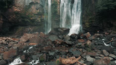 Tourists-On-Standing-On-Boulders-At-Nauyaca-Waterfalls-In-Costa-Rica