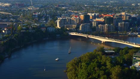Aerial-Zoom-In-View-of-Morning-Traffic-on-Captain-Cook-Bridge-with-Residential-Buildings-in-the-Background,-Brisbane-City-Australia