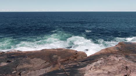 Ocean-Waves-Crashing-At-The-Rocky-Waterfront-At-Freshwater-Beach-In-Australian-State-Of-New-South-Wales