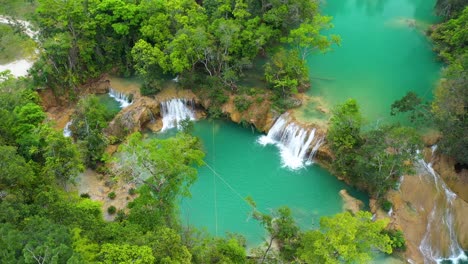 Aerial:-tropical-Cascadas-de-Roberto-Barrios-waterfall-in-Mexico-rainforest
