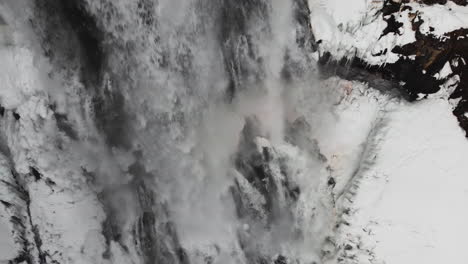 Alexander-Falls,-Frozen-Waterfall-In-Whistler,-British-Columbia,-Canada---close-up,-drone-shot