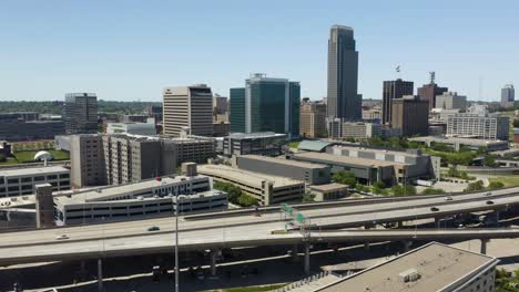 Cars-Driving-on-Highway-with-Downtown-Omaha,-Nebraska-Skyline-in-Background