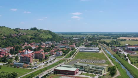 Slovenian-countryside-town-Lendava-on-sunny-day,-aerial-4K-view