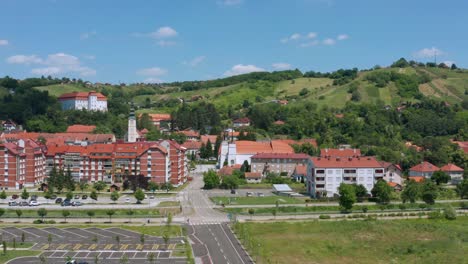 Aerial-View-Of-Apartment-Complex-With-Lendava-Castle-And-Mountain-Views-In-Prekmurje,-Slovenia