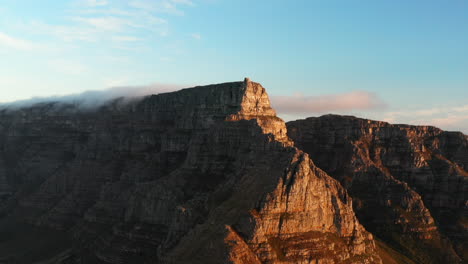 Aerial-sunset-over-Cable-Station-on-Table-Mountain,-Cape-Town,-South-Africa